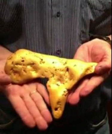 Person holding a giant gold nugget found in Ballarat.