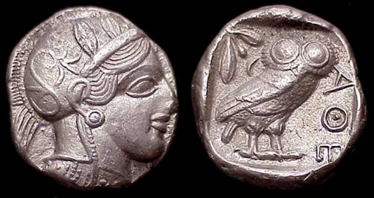 Faces of a Greek tetradrachm silver coin