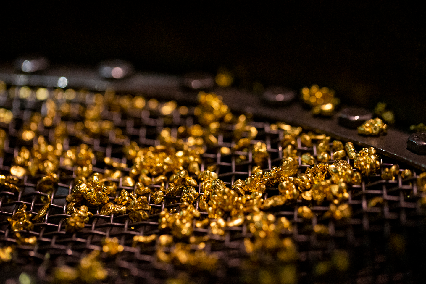 An image of gold granules in a tray