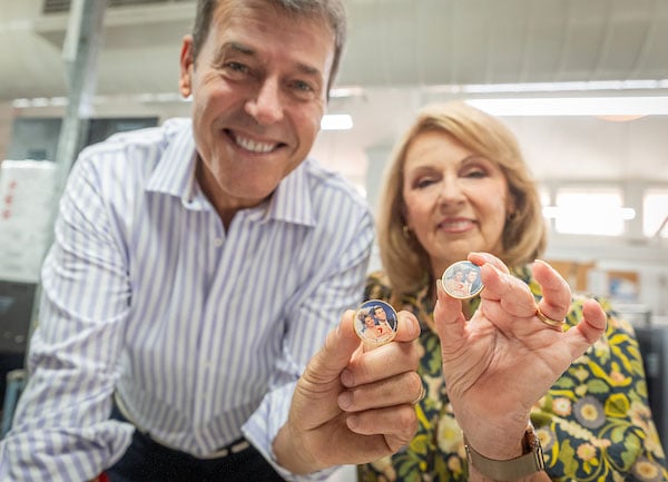 Rick and Susannah holding their Perth Mint Medallions