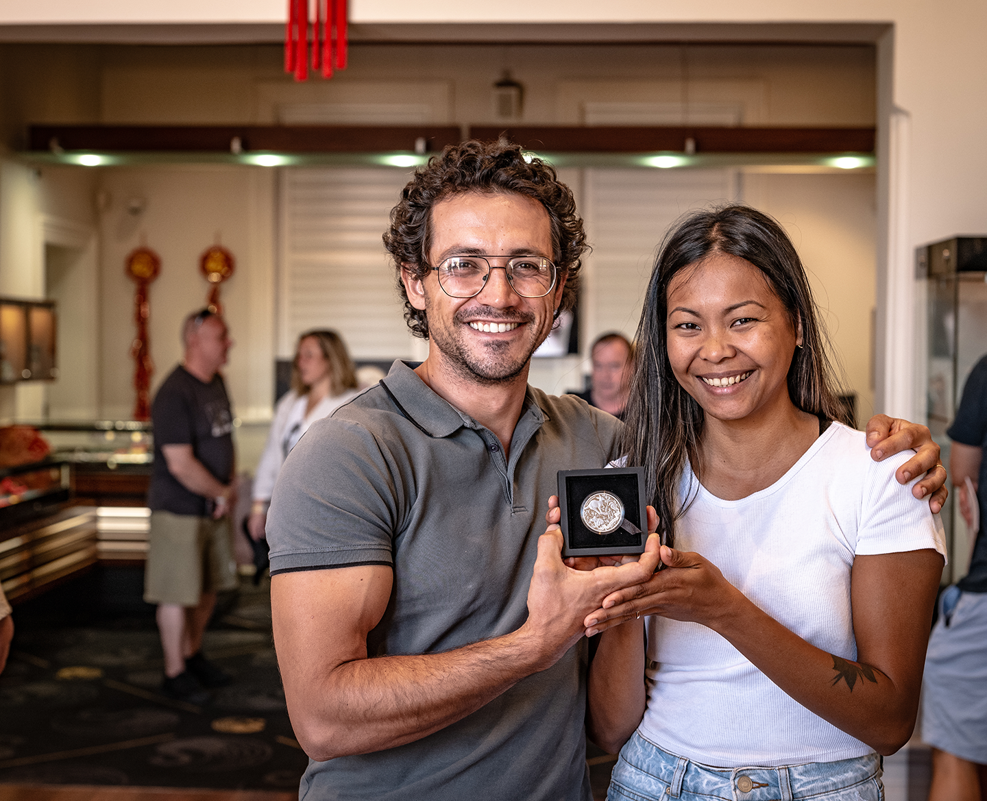 Diego and Maria in the coin shop where they met for the first time in 2018